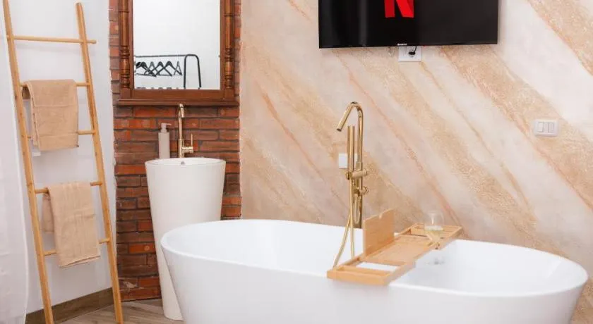 Marcos Apartments I Bathtub in Bedroom experience - Image 1