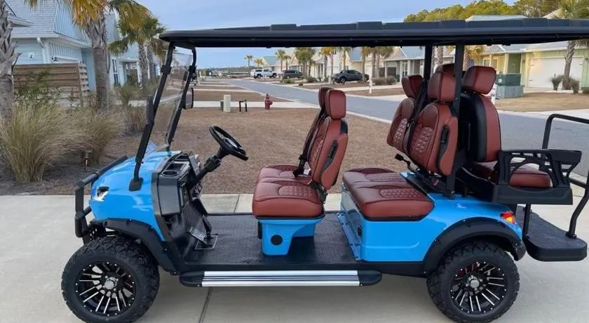 4BR Coastal Stay with MIL Suite & Golf cart, Walk to Beach & Dining - Image 1
