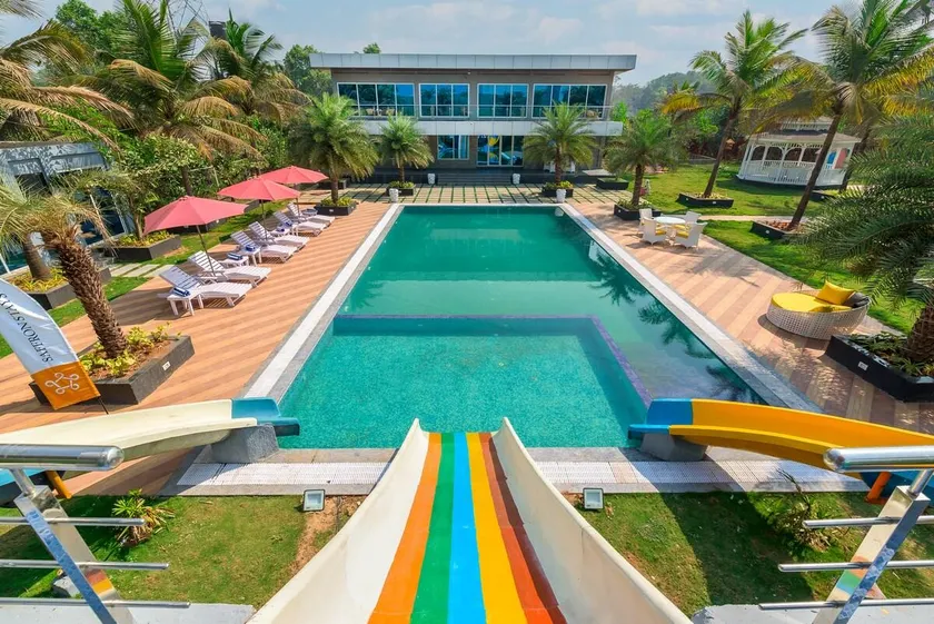 SaffronStays Palm Paradise - twin 3BR villas with pool, slides, mango plantations & outdoor games near Mumbai - Image 1