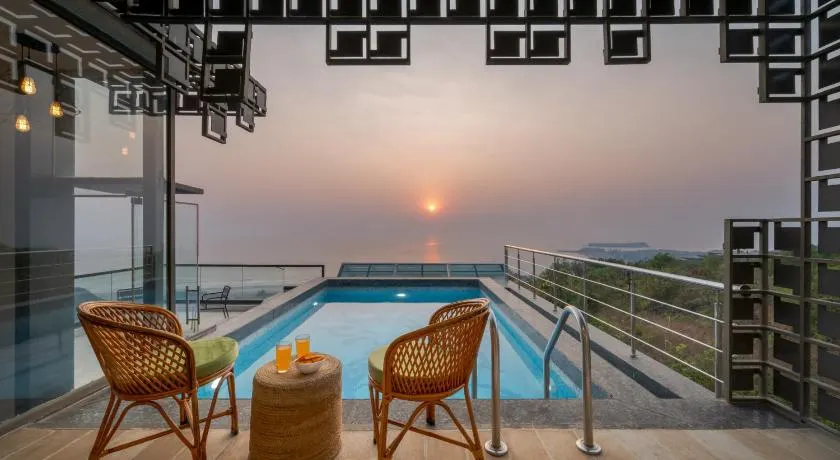 SaffronStays Nautica - 5BR hilltop villa with rooftop pool, sea views & modern interiors surrounded by greenery - Image 1