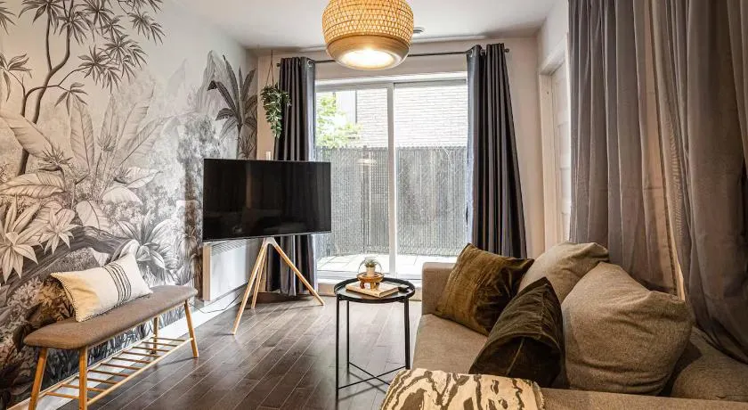 Modern 2BR Retreat with Parking & Gym Near Downtown & Airport - Image 1