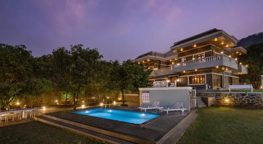 SaffronStays Peshwaai - 5BR Karjat villa with lawn pool & terrace plunge, mezzanine family rooms, near Songiri & Kondhana - Image 1