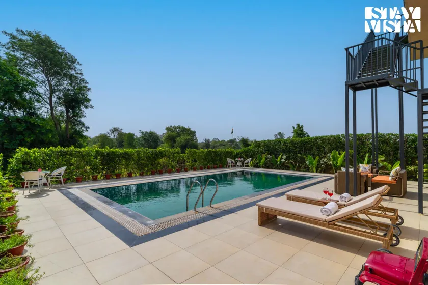 StayVista at Avanya Retreat with Bonfire, BBQ, Outdoor Pool - Image 1