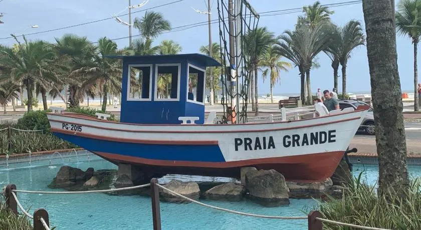 APARTAMENTO NA PRAIA GRANDE A 200 MÉTROS DA PRAIA, CONFORTÁVEL ESPAÇOSO WIFI 350 Mega TV Claro, ÓTIMA LOCALIZAÇÃO - Image 1
