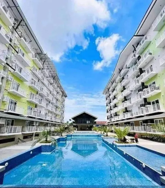 Amani Grand Resort Residences by JC SpaceRentals balcony pool view, Ground floor, 5mins from airport, free WIFI, NETFLIX - Image 1