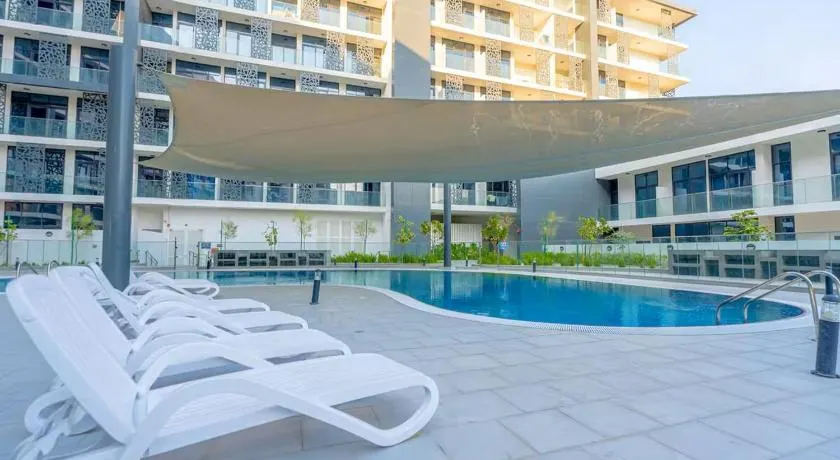 Vogue Vacation Homes, Khalifa City The Gate near Yas Island and Ferrari World, One Bedroom Apartment with Balcony and City view, Access to all Amenities - Image 1