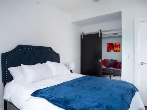 Luxury 2BR Suite with Riverfront Views Pool table Rooftop Patio BBQ Coffee - Image 1