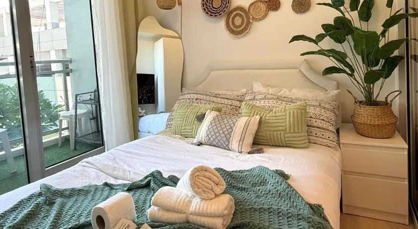 Cozy Green 1 BR unit with Balcony Azure Bahamas South - Image 1