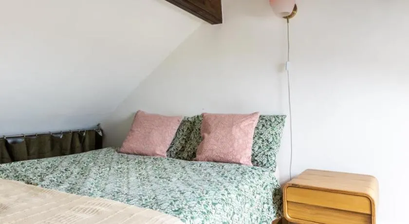 En-suite with double bed on mezzanine and desk in family home - Image 1