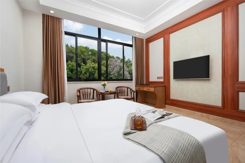Xinggang Business Hotel - Image 1