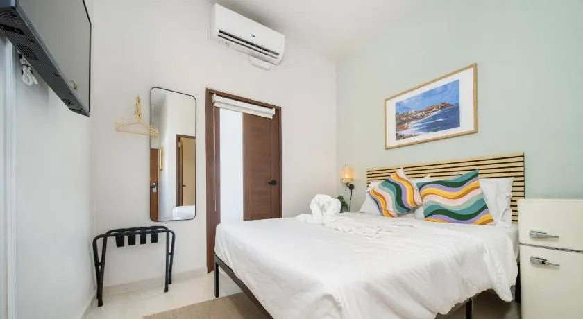 Room 12: Sunlit Balcony Stay w/ Free Parking | Calle Cerra - Image 1