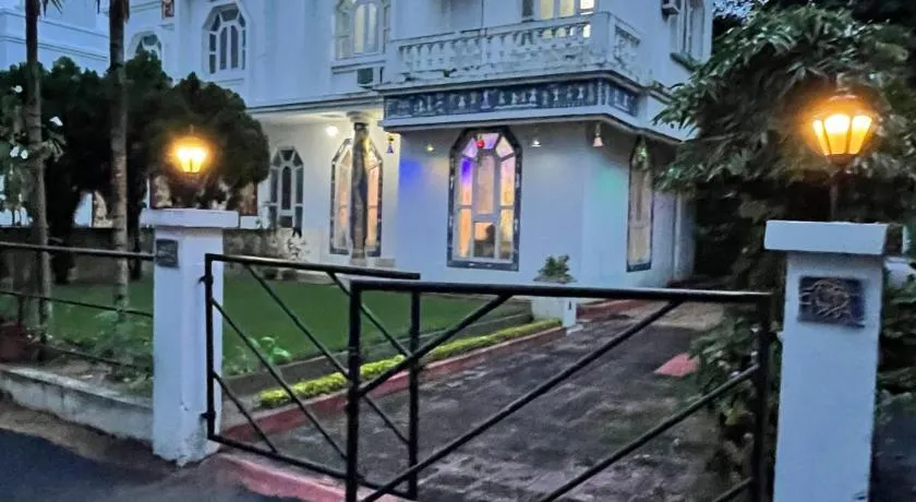 Shantiniketan Bungalow with green lawn - Image 1