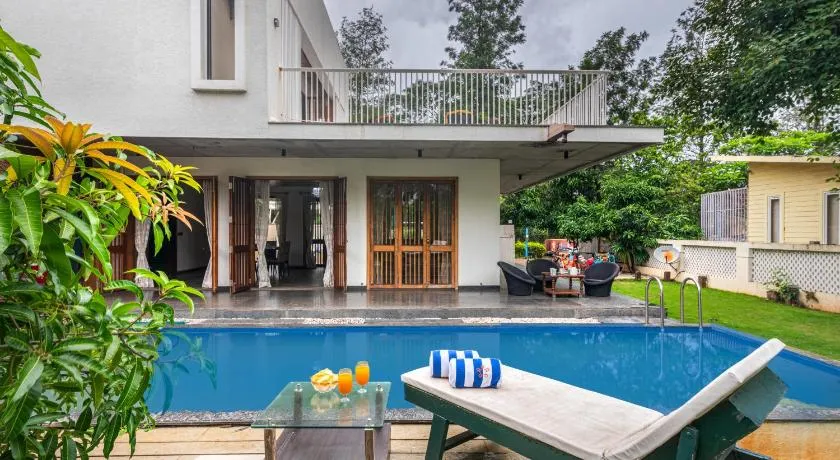SaffronStays Amrapali - 5BHK Villa in Nashik with Pool, Lawn & Kids Play Area - Image 1