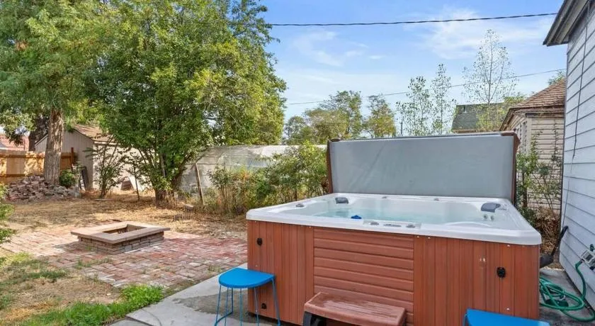 City Lights Soaking Nights Hot Tub Near Arena - Image 1