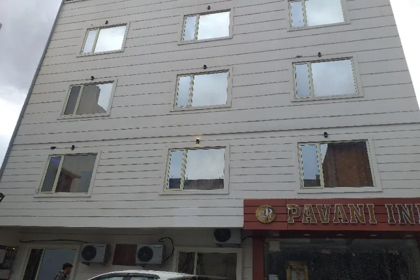 Capital O Pavani Inn - Image 1