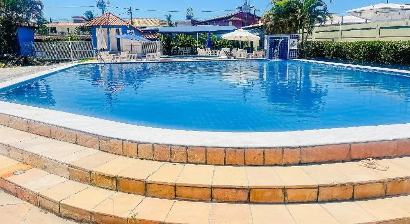 Condomínio Golden Dolphin a uma quadra do Axé Mói, com piscina, churrasqueira, portaria 24hrs, de frente à supermercado, e centro gastronômico - Image 1