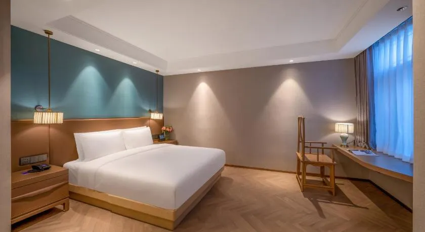 Manxin Hotel Qingdao Xindu - Image 1