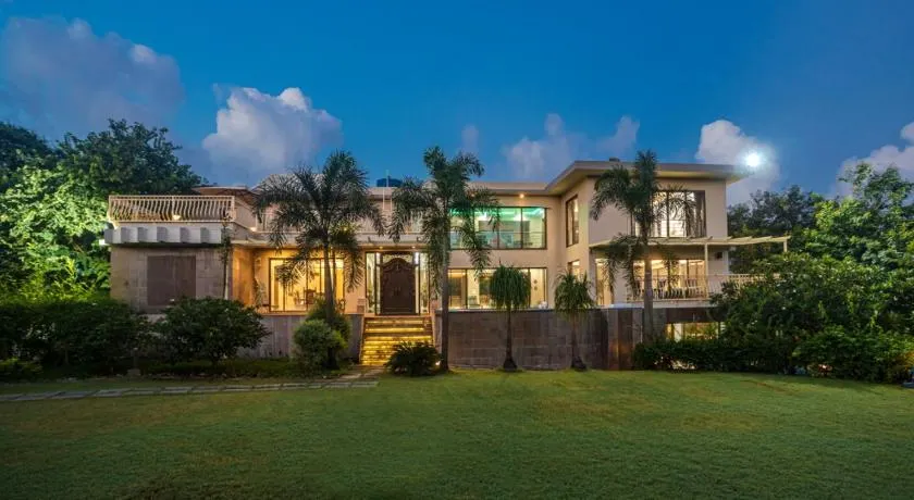 SaffronStays Aura - 4BR luxury pool villa with gym, BBQ deck, lawns & indoor games near Kihim Beach - Image 1