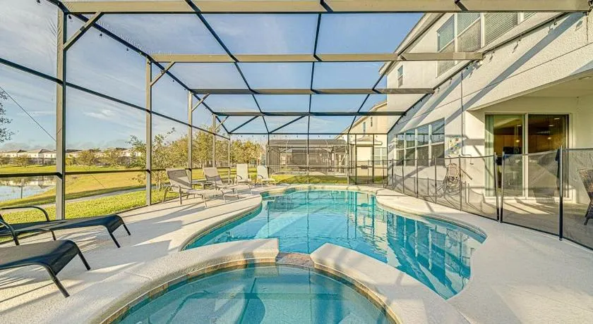 #371-Stunning 6 bed with modern decor, south facing pool and spa overlooking water - Image 1