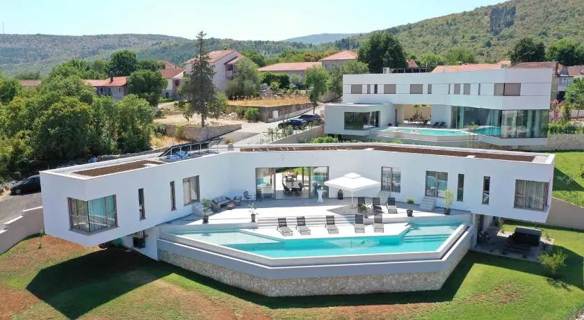 A modern villa in Zmijavci with a gym, tennis and basketball court - Image 1