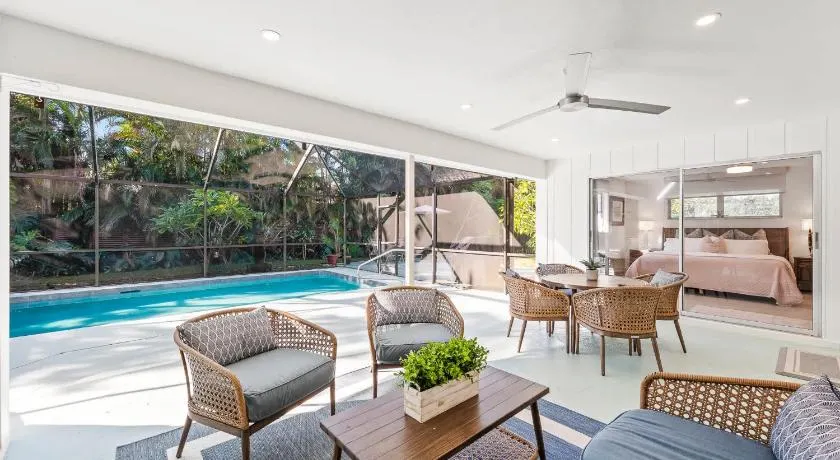 Pesaro - stylish 3BR retreat near Via Miramar Beach, beautifully renovated home with a private pool, lush tropical gardens and premium modern comforts, perfect for families and relaxing getaways, just minutes from sandy beaches and vibrant downtown Naples - Image 1