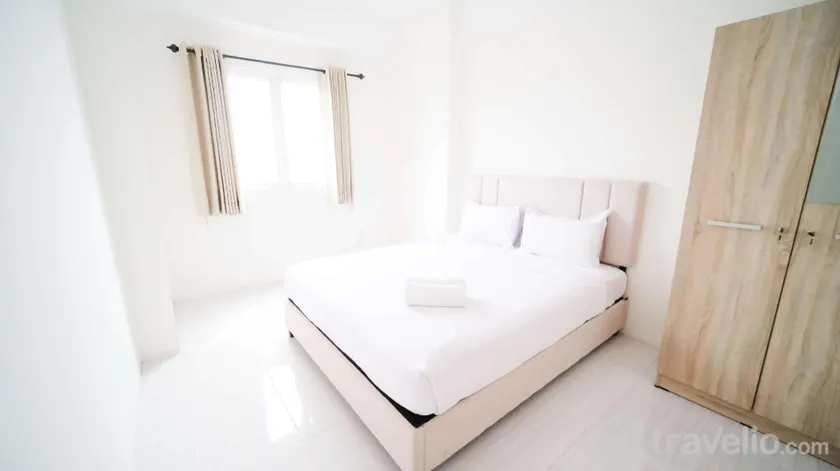 Best Choice and Homey 2BR at Puncak Dharmahusada Apartment By Travelio - Image 1