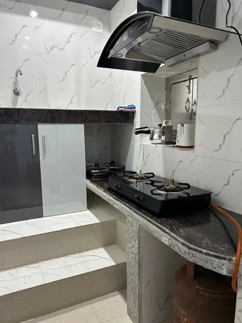 Rumi HomeStays-103-1 BHK Premium Furnished Room with Modern Bathroom, Kitchen and Dining - Image 1