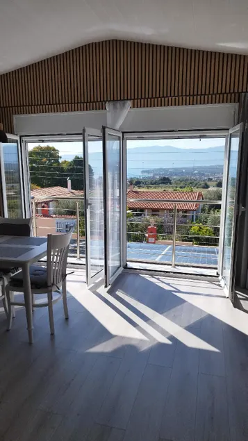 Sunny Home Loutraki is a modern studio with views of the bay and mountains with private parking - Image 1