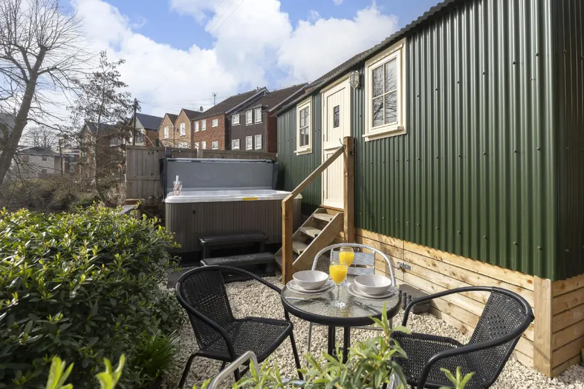 Riverside Shepherd’s Hut with Hot Tub - Image 1