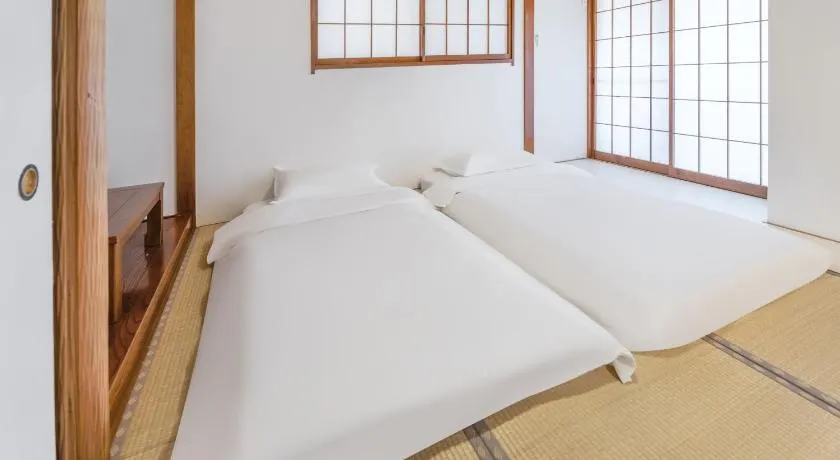 102Room,Free parking just a 7-minute walk from Koiwa tram stop This spacious 75-square-meter flats features two large bedrooms and can accommodate up to seven guests - Image 1
