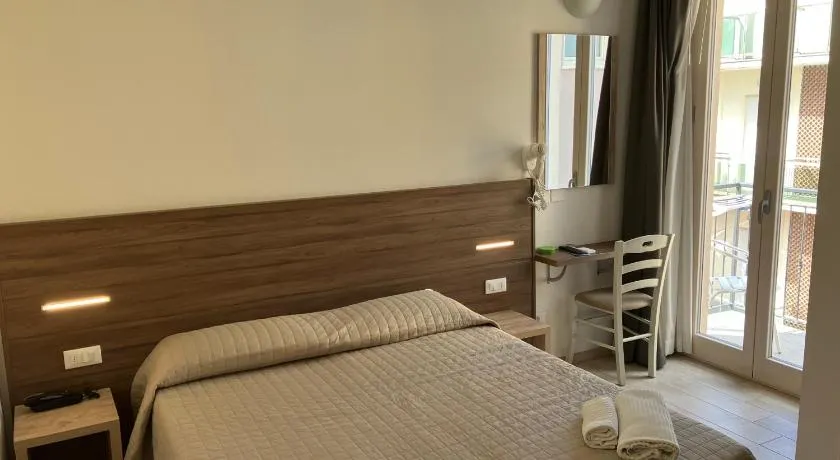 Hotel Bed and Book - Image 1