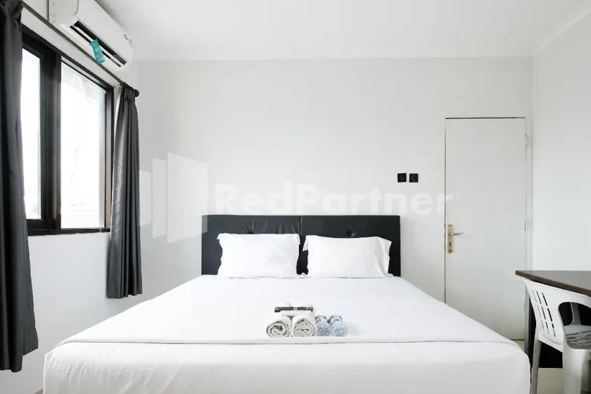 Aster Triplets Guest House JCM Mitra RedDoorz - Image 1