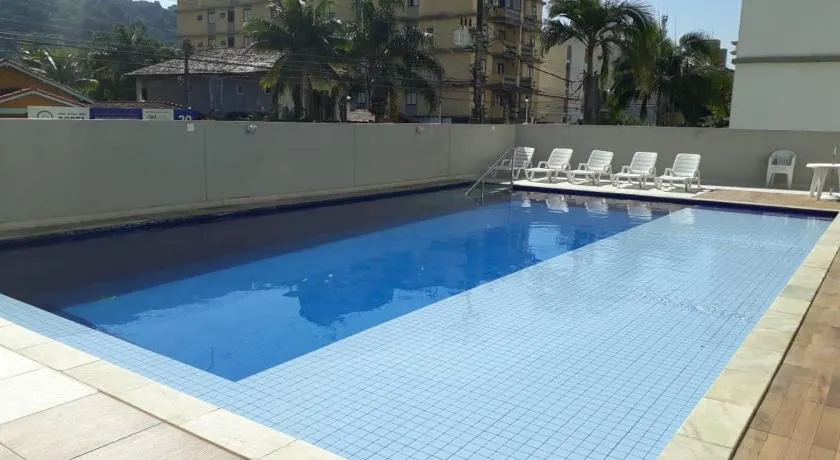 Apartamento 500m Praia da Enseada Guarujá varanda e vaga de garagem - Image 1