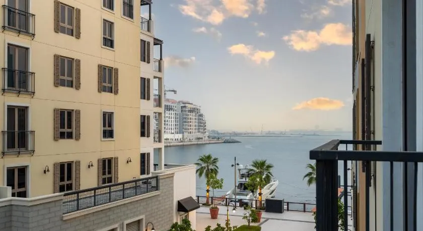 Ultimate Stay - Stylish 1BR Apartment in La Mer Dubai with Balcony and Partial Marina Views - Image 1