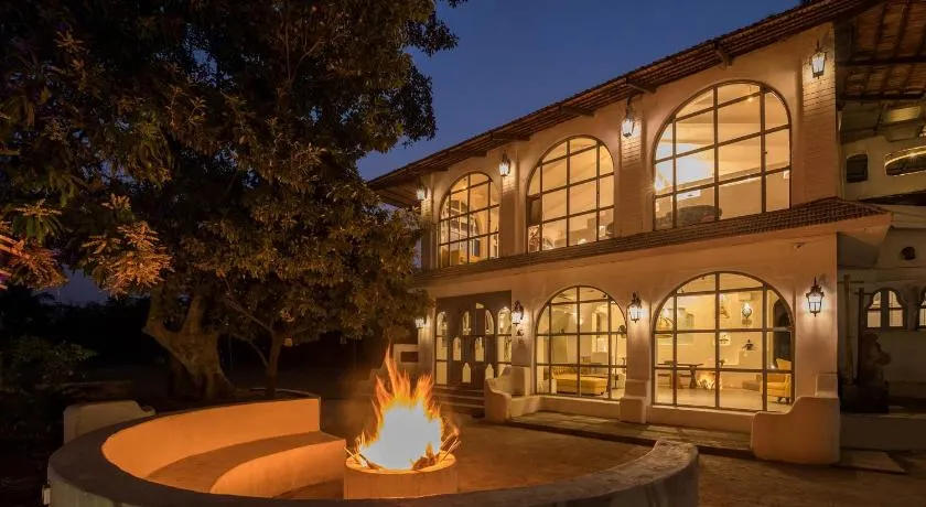 StayVista's Casa Blanca - Modern elegance with a pool, spacious lawn & diverse activities - Image 1