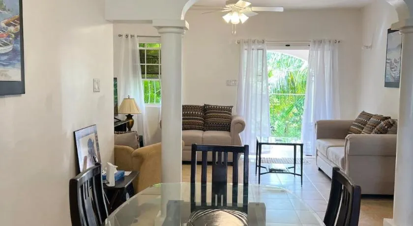 Oistins 2BR Condo with Pool & Patio, Walk to Miami Beach - Image 1