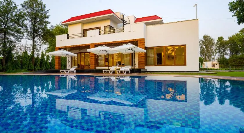 ELIVAAS Sanisa Farm 3-BHK Farmhouse with Pvt Pool, Game Zone & Lush Garden - Image 1