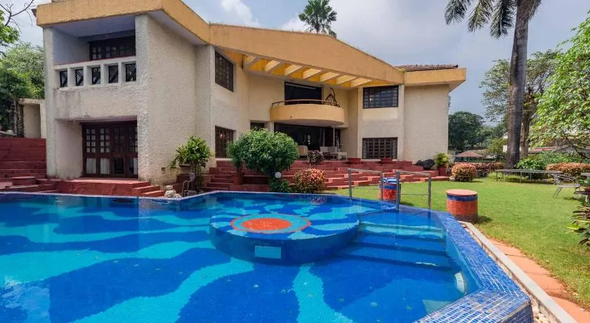 StayVista's Shantam House - Dive into relaxation with a pool and tennis lawn - Image 1