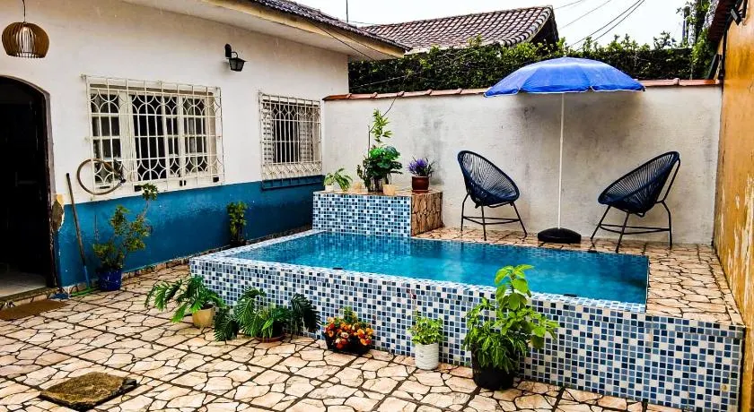 Casa de praia com piscina e área externa gourmet - Image 1