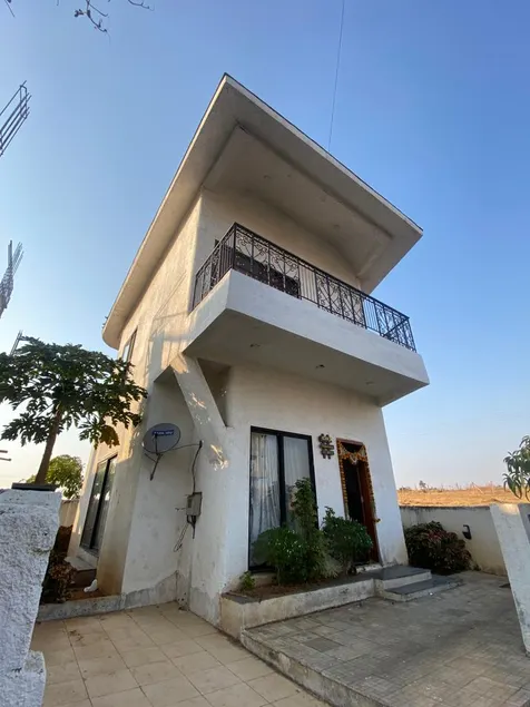 Spanish-inspired 2 BHK White Villa - Brinla Homes - Image 1