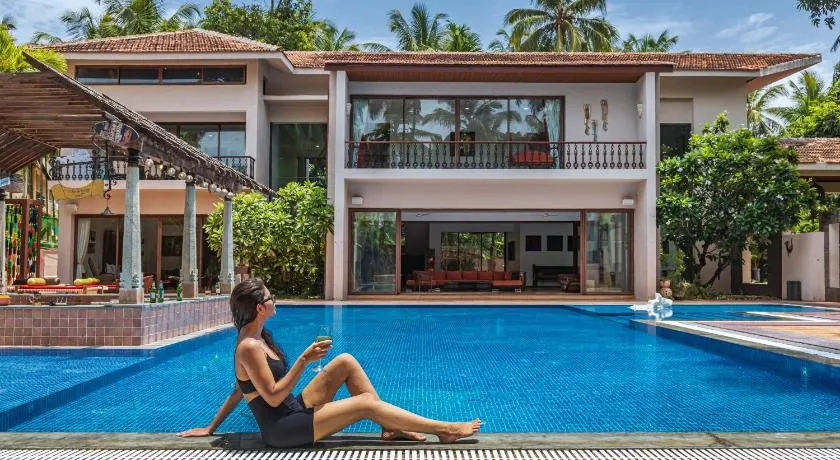 SaffronStays Casa Del Palms - 8BR luxury pool villa with gazebo, pickleball, bar & lawns near Nagaon Beach - Image 1