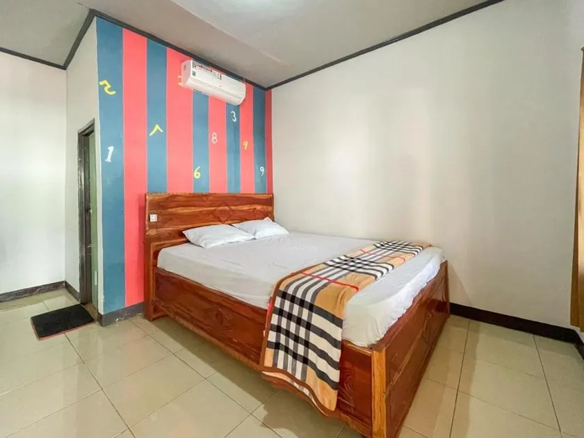 Ekas Beach Guesthouse Mitra RedDoorz - Image 1