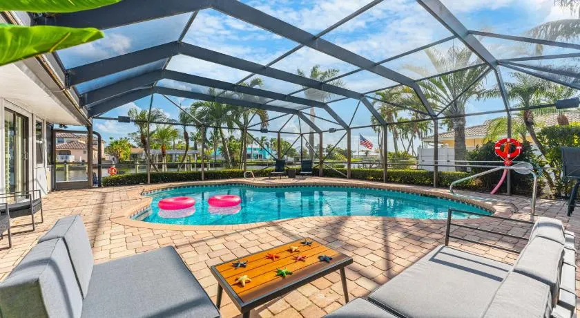 Casa De Olas - Waterfront Luxe Home - Heated Pool - Game Room - Boat Lift - Minutes to Beach - Image 1