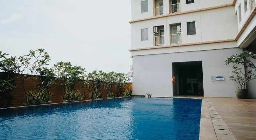 Apartemen Mahogany oleh Halahouse - Image 1