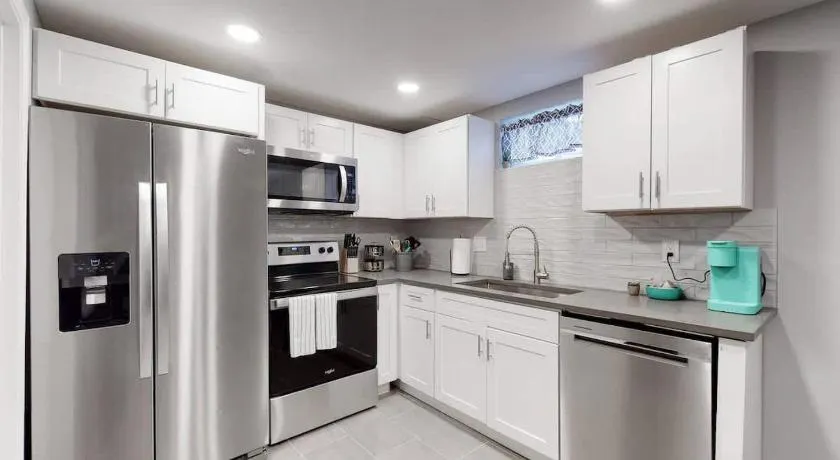 Bright basement unit with large yard and sunroom - Image 1