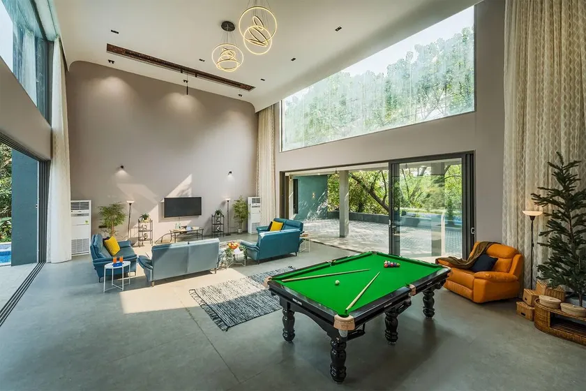 SaffronStays Six Degrees - 6BR pool villa with high-ceiling interiors, lawns, swings & pool table near Awas Beach - Image 1