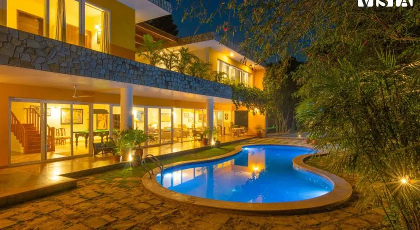 StayVista at The Hideout Farms with Lawn and private Pool - Image 1
