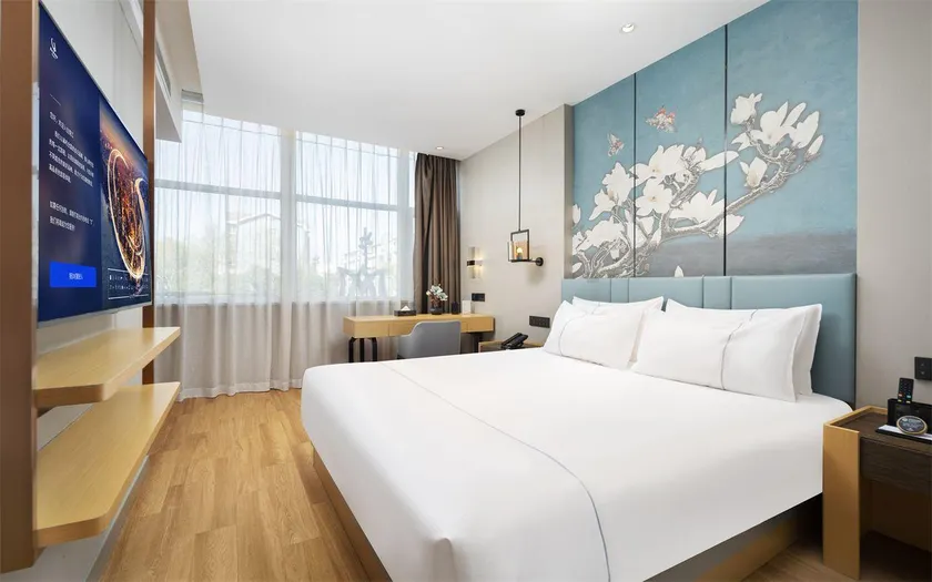 Magnolia Business Hotel (Luoyang Museum Longmen High-speed Railway Station Branch) - Image 1