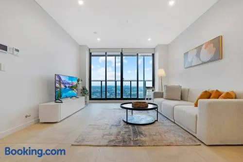 Modern 2BR with City Views & Pool Near Parramatta - Image 1