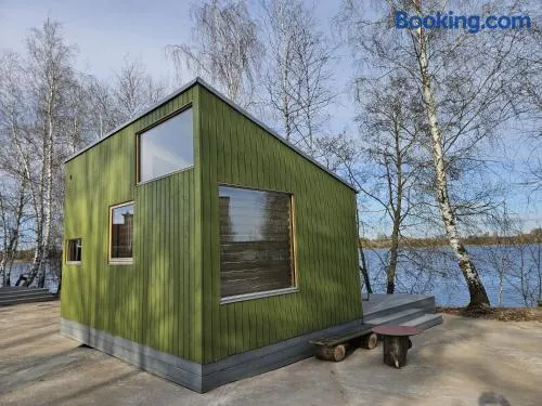 Piestātne Riverside Cabin with Sauna, Hot Tub & Private Pier - Image 1